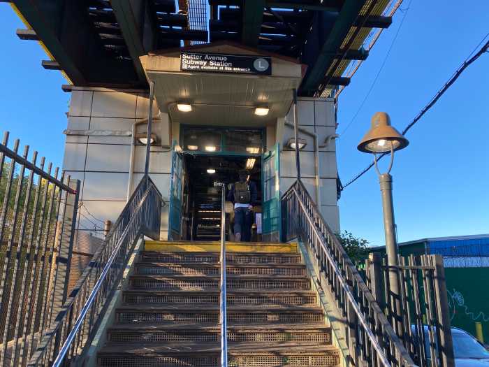 stairs leading up to a train station