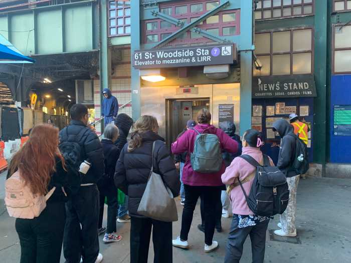 Rail rot: 7 train repairs delayed two years, and costs soar, over 'unexpected' deterioration and decay found at one Queens station 2 people wearing cold-weather coats gathered at an outdoor elevator