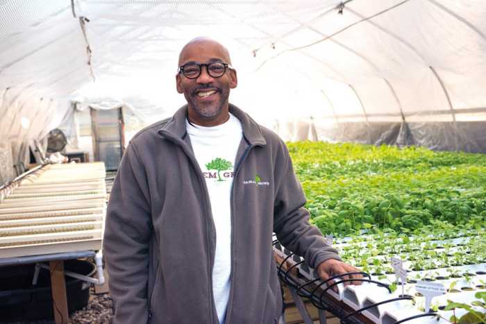 Tony Hillery working in the Harlem Grown urban farm greenhouse.