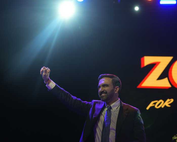 mayor-elect zohran mamdani raises fist in air at victory party