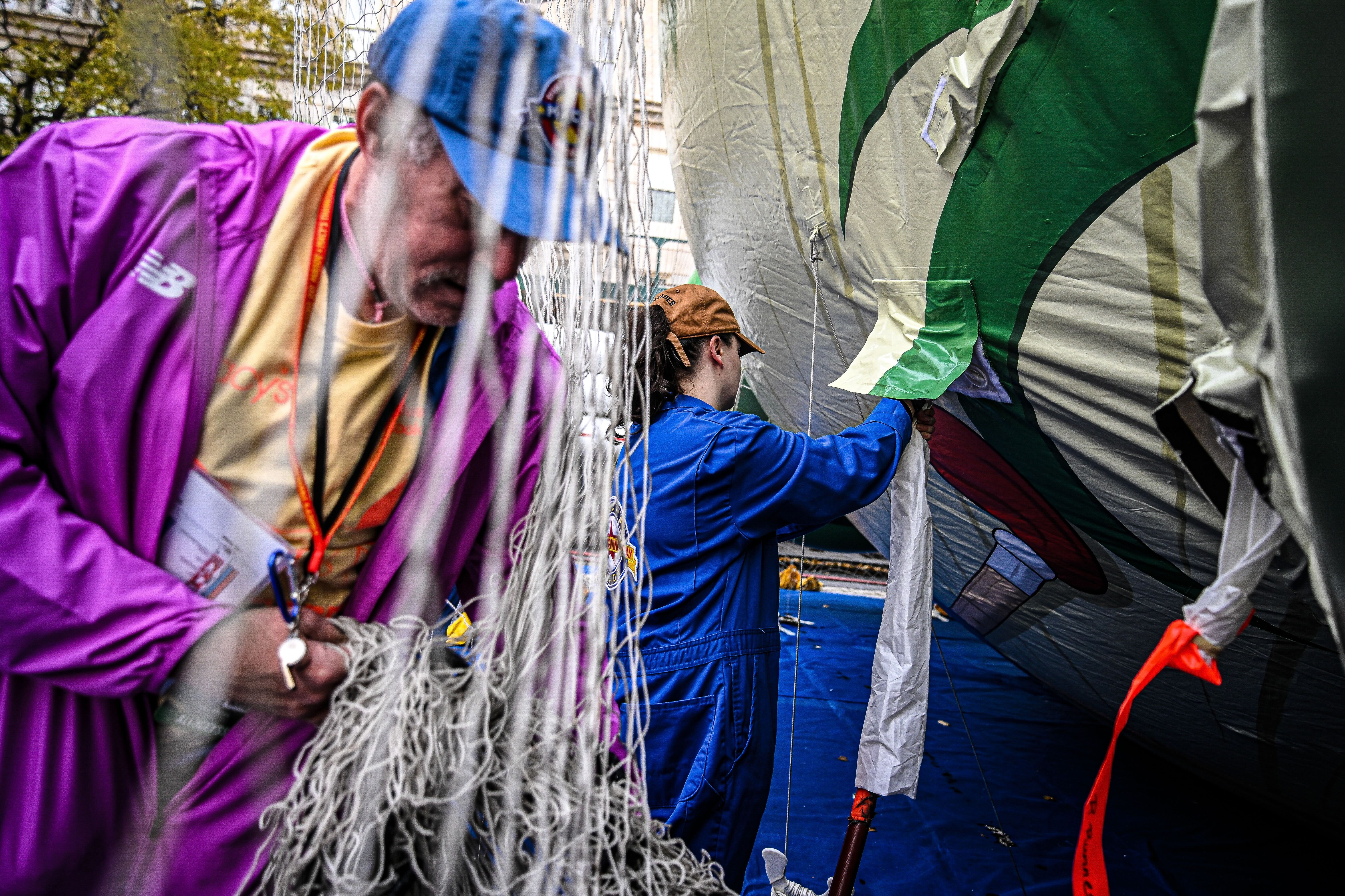 Workers inflate the Macy's Thanksgiving Day Parade balloons.
