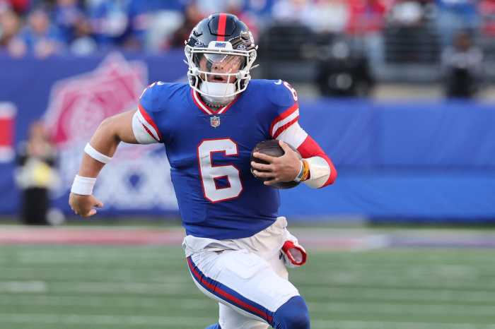 Giants quarterback Jaxson Dart (6) sits on the bench during the first half against the San Francisco 49ers at MetLife Stadium on Oct. 2, 2025.
