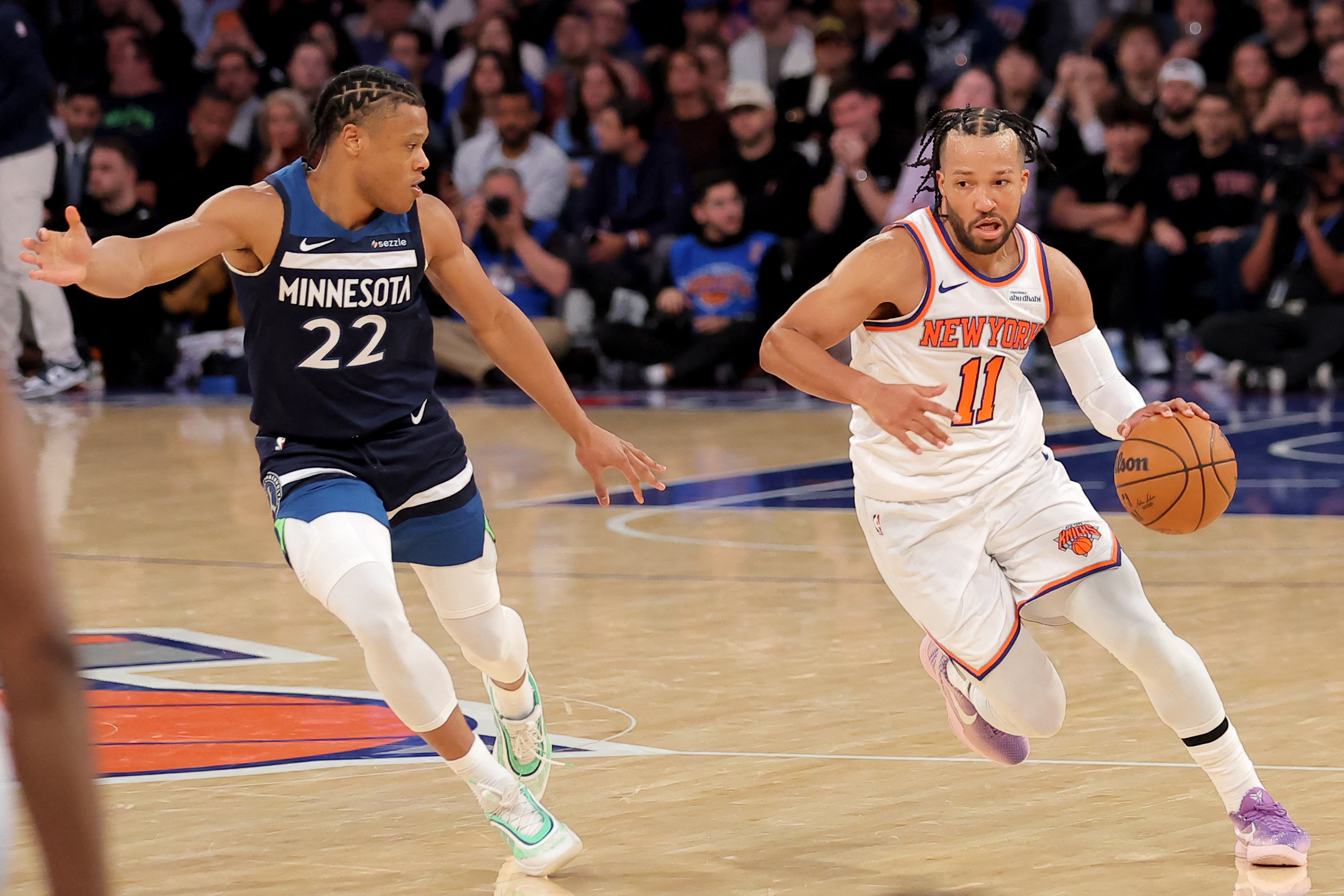 Nov 5, 2025; New York, New York, USA; New York Knicks guard Jalen Brunson (11) controls the ball against Minnesota Timberwolves guard Jaylen Clark (22) during the third quarter at Madison Square Garden.
