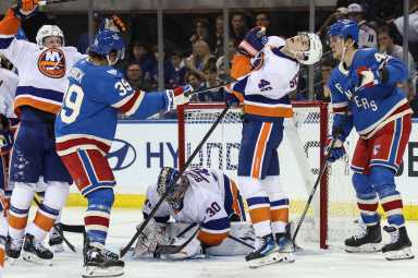 Islanders stop a Rangers goal on home ice at Madison Square Garden