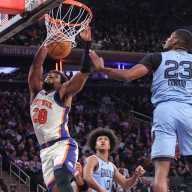 Knicks' offense on historic run as they stay undefeated at the Garden with 133-120 win over Grizzlies 13 Nov 11, 2025; New York, New York, USA; New York Knicks forward Guerschon Yabusele (28) dunks past Memphis Grizzlies forward Cedric Coward (23) in the second quarter at Madison Square Garden.