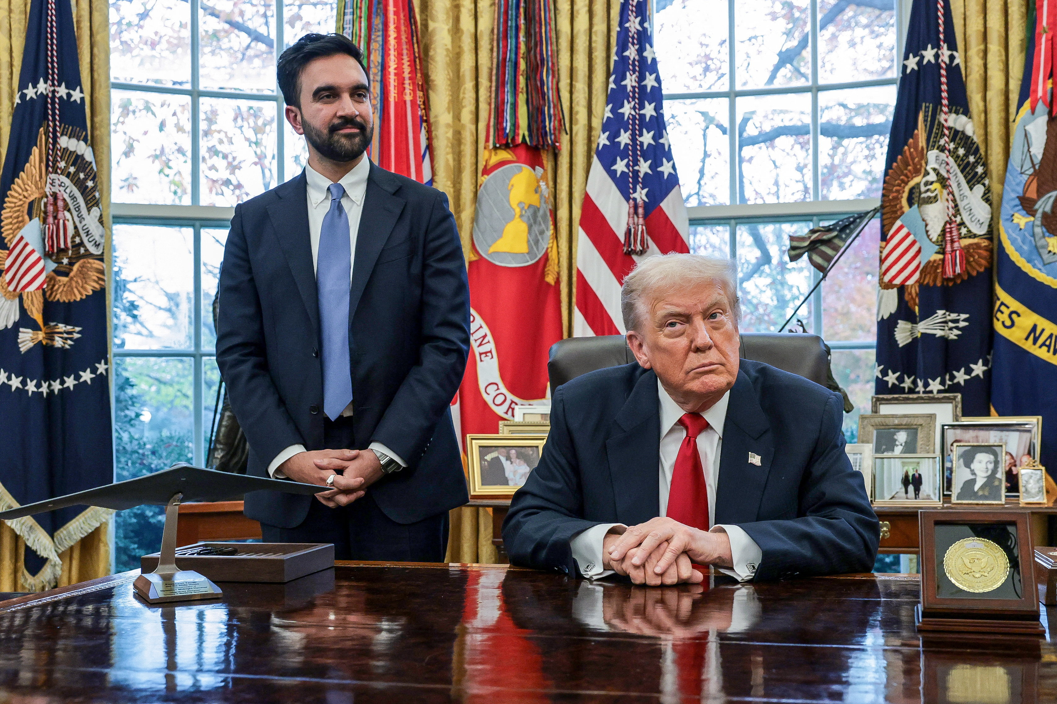 U.S. President Donald Trump and New York City Mayor-elect Zohran Mamdani speak to members of the media as they meet in the Oval Office at the White House in Washington, D.C., U.S., November 21, 2025. 