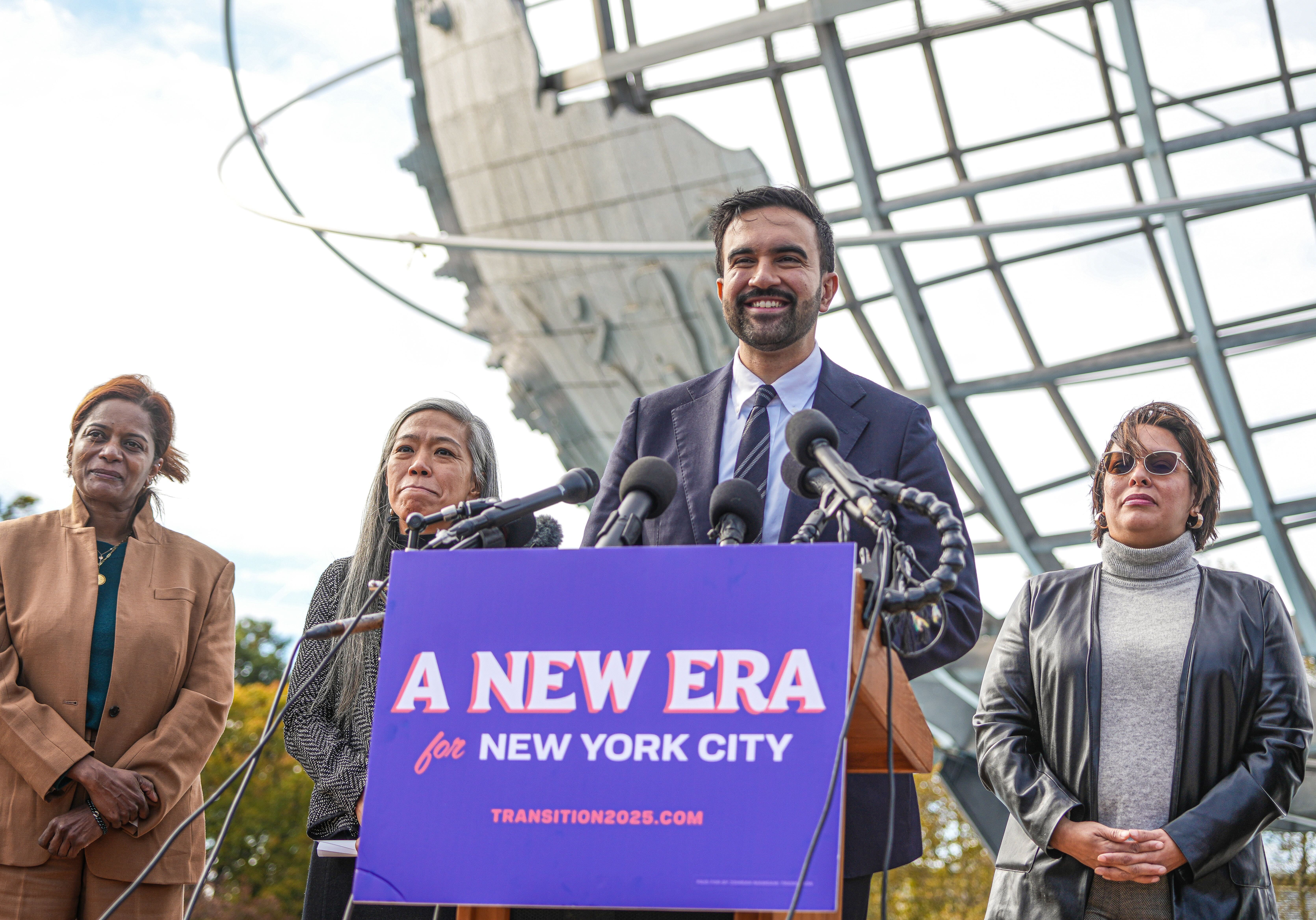 Mayor-elect Zohran Mamdani stands with members of his transition team