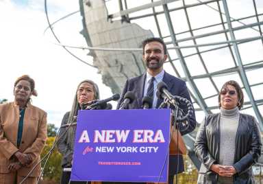 Mayor-elect Zohran Mamdani stands with members of his transition team