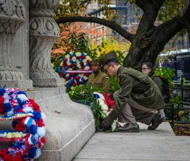 A soldier lays a wreath at the NYC Veterans Day Parade in Midtown on Nov. 11, 2025.