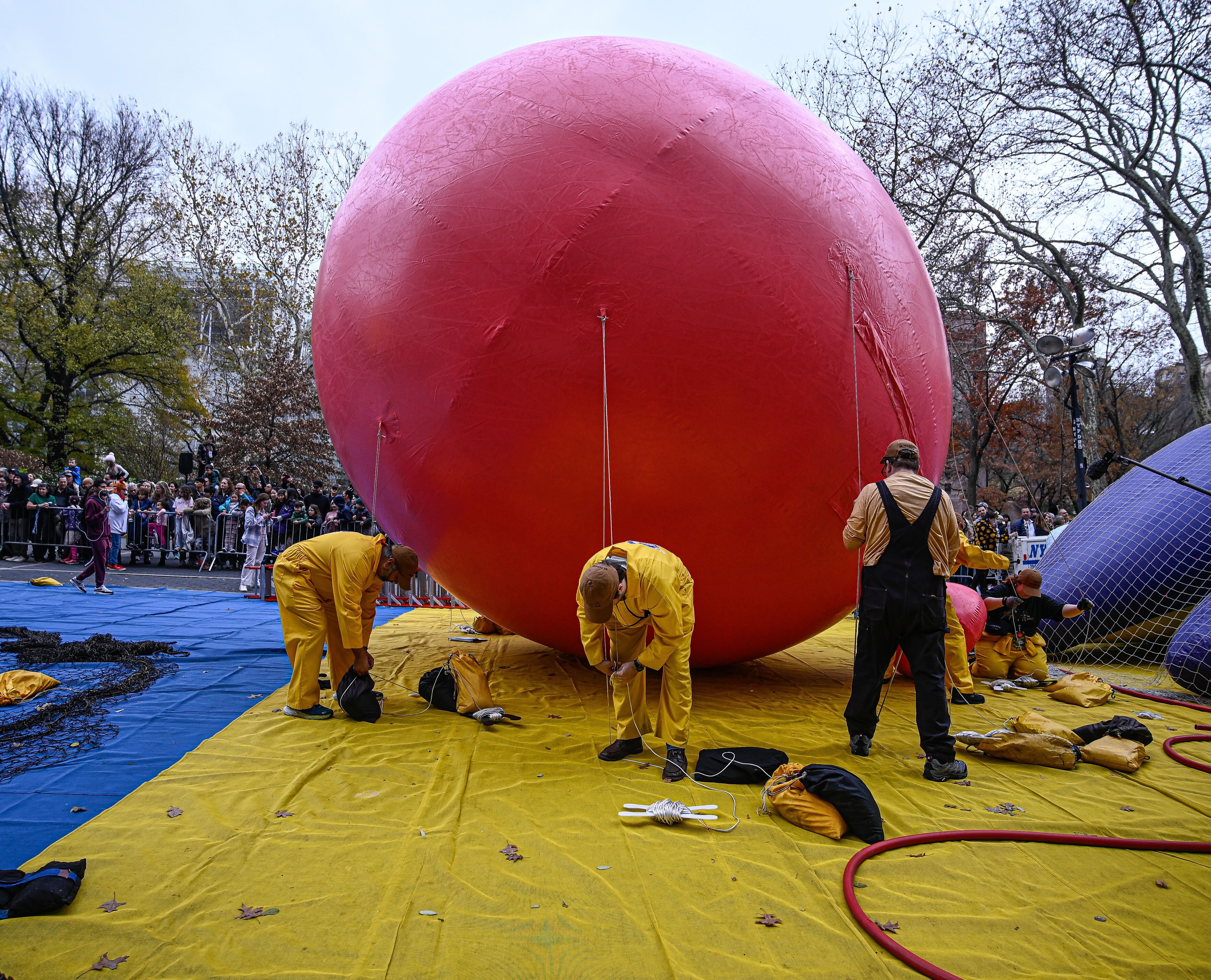 Workers inflate the Macy's Thanksgiving Day Parade balloons.