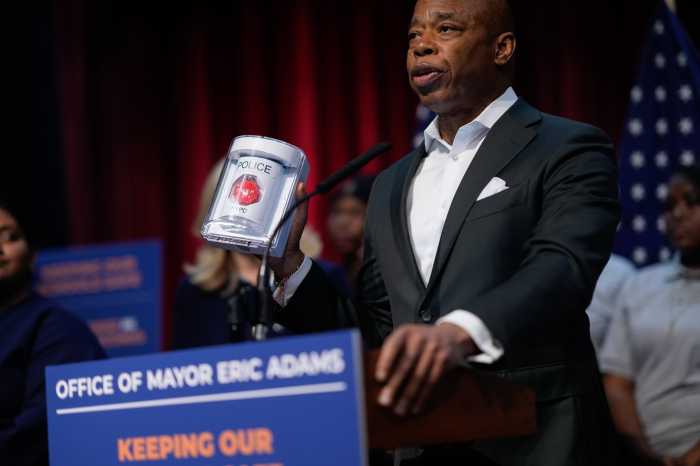 mayor eric adams with school safety button