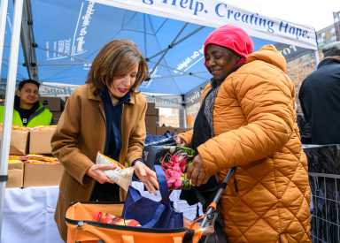 governor kathy hochul providing food to person amid hunger crisis in NYC
