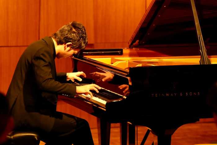 a boy playing the piano
