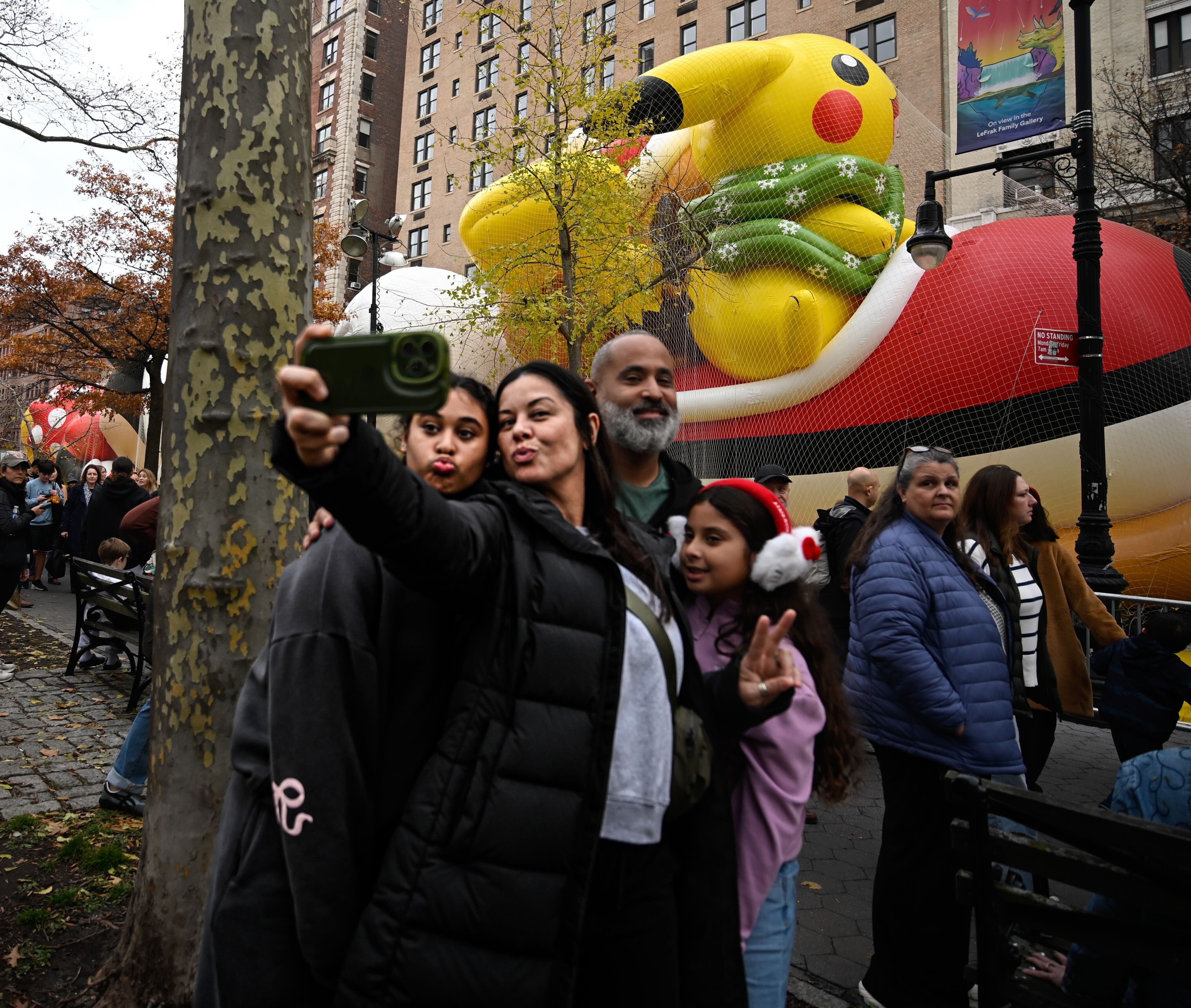 Spectators took selfies with the inflated balloons.