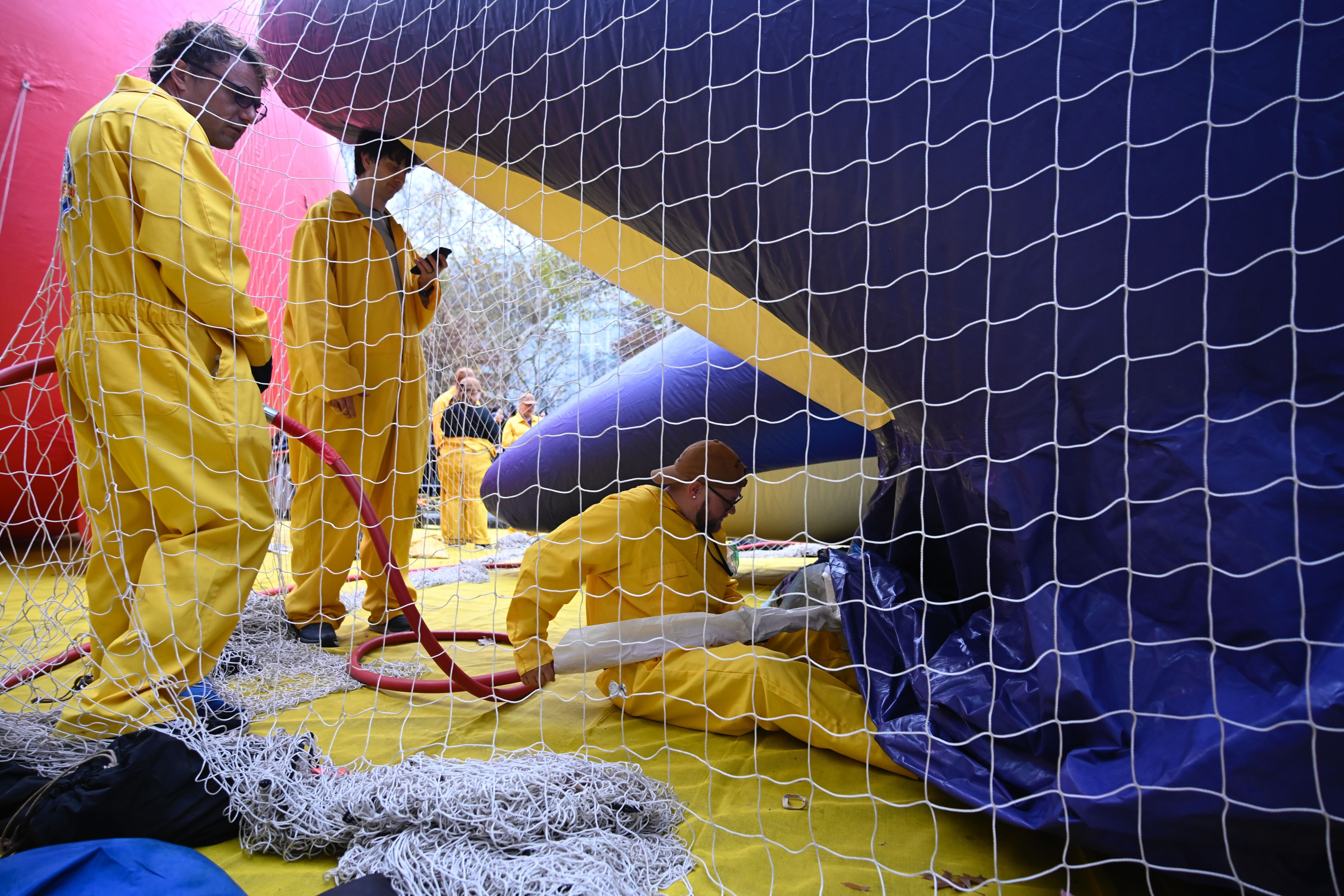 Workers inflate the Macy's Thanksgiving Day Parade balloons.