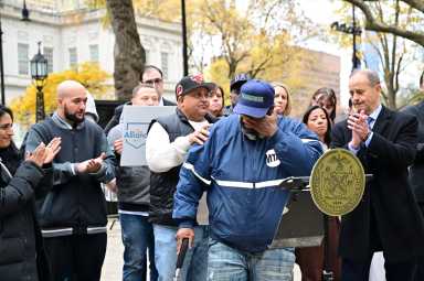 Abuse survivor Austin Stevens speaks at City Hall Park speaks at a rally in City Hall Park on Tuesday before the City Council vote to restore GMVA claims.
