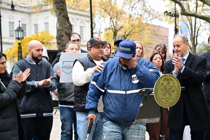 Abuse survivor Austin Stevens speaks at City Hall Park speaks at a rally in City Hall Park on Tuesday before the City Council vote to restore GMVA claims.