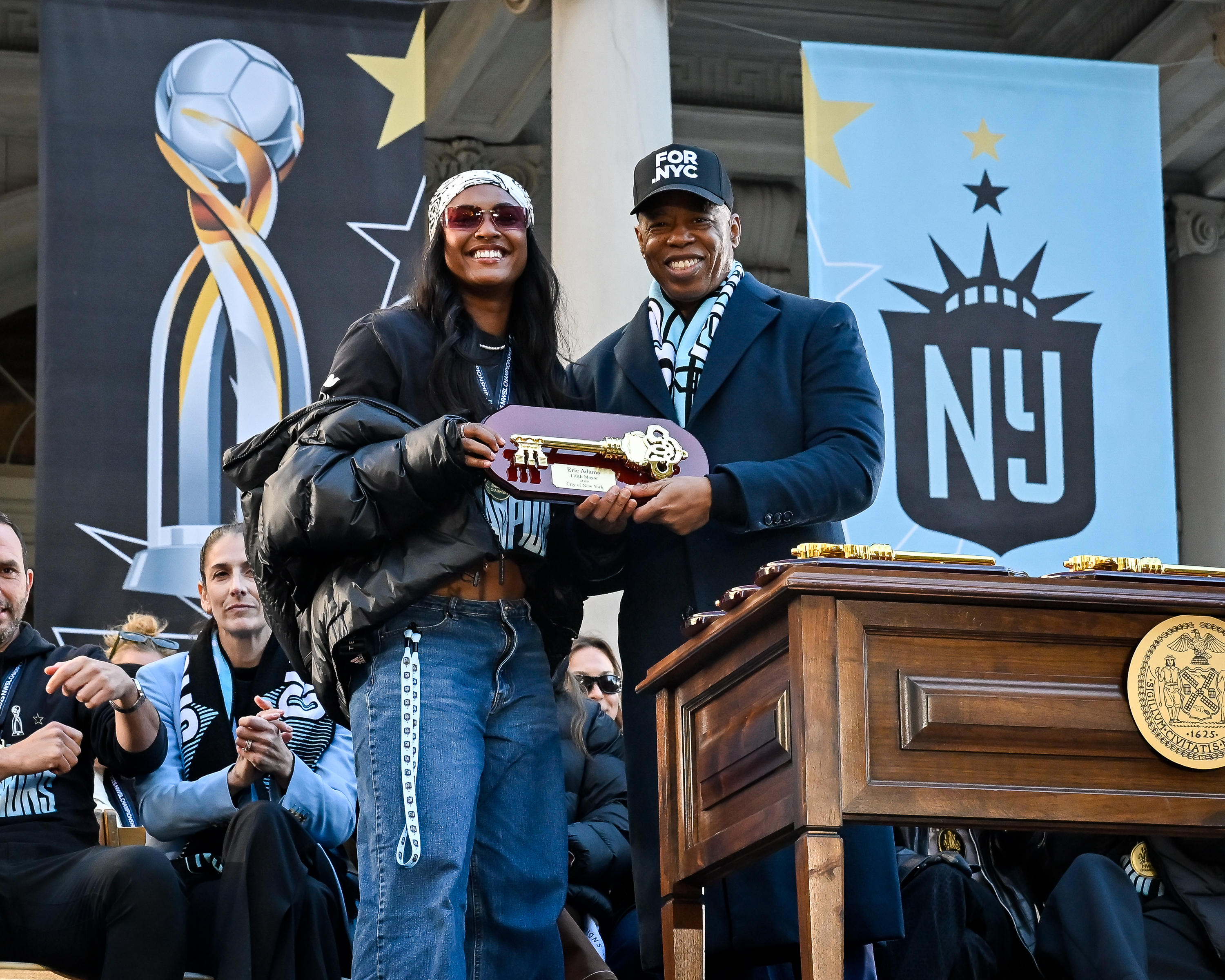 Mayor Eric Adams presents the Keys to the City to Jaedyn Shaw. 