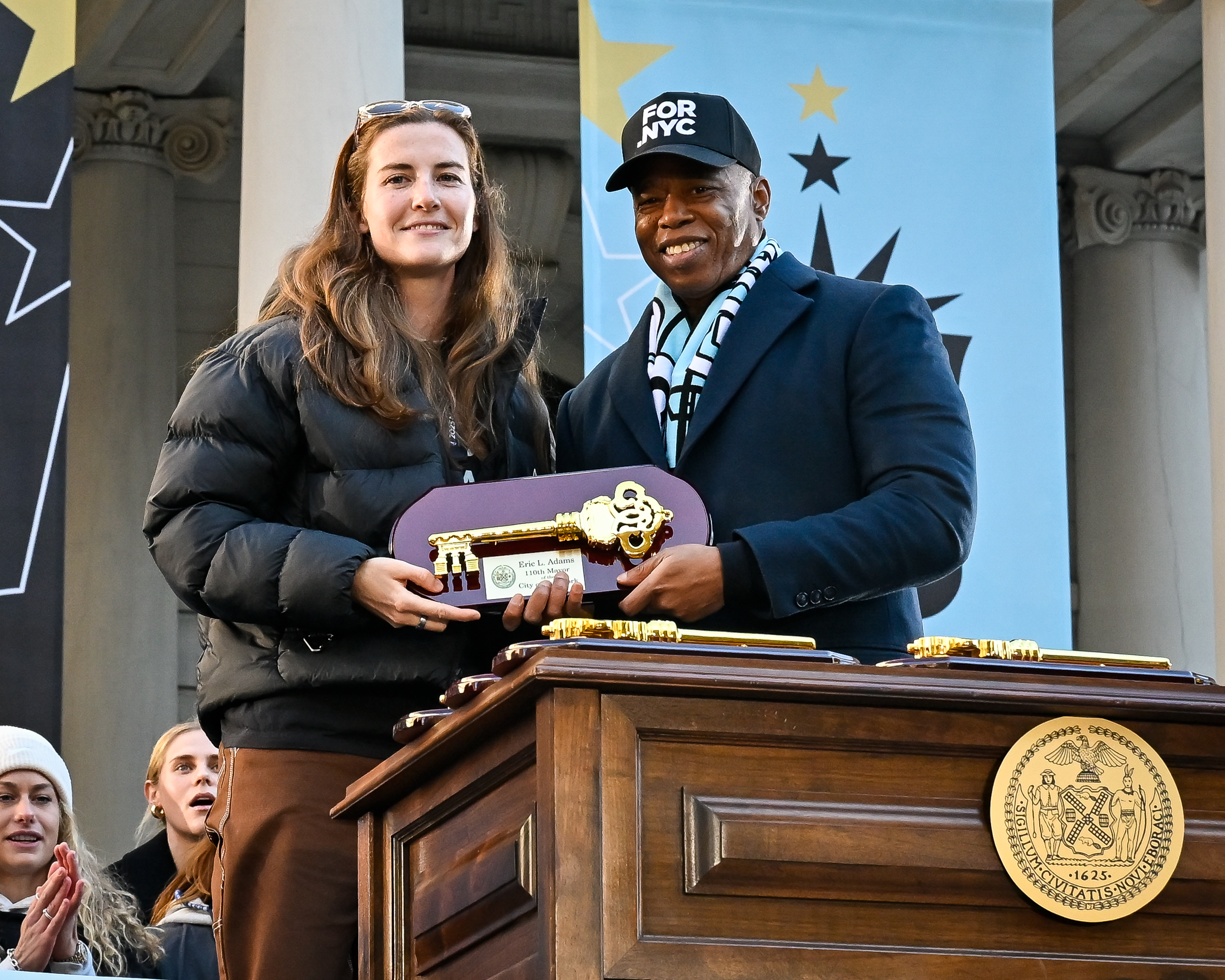 Mayor Eric Adams presents the keys to the city. 