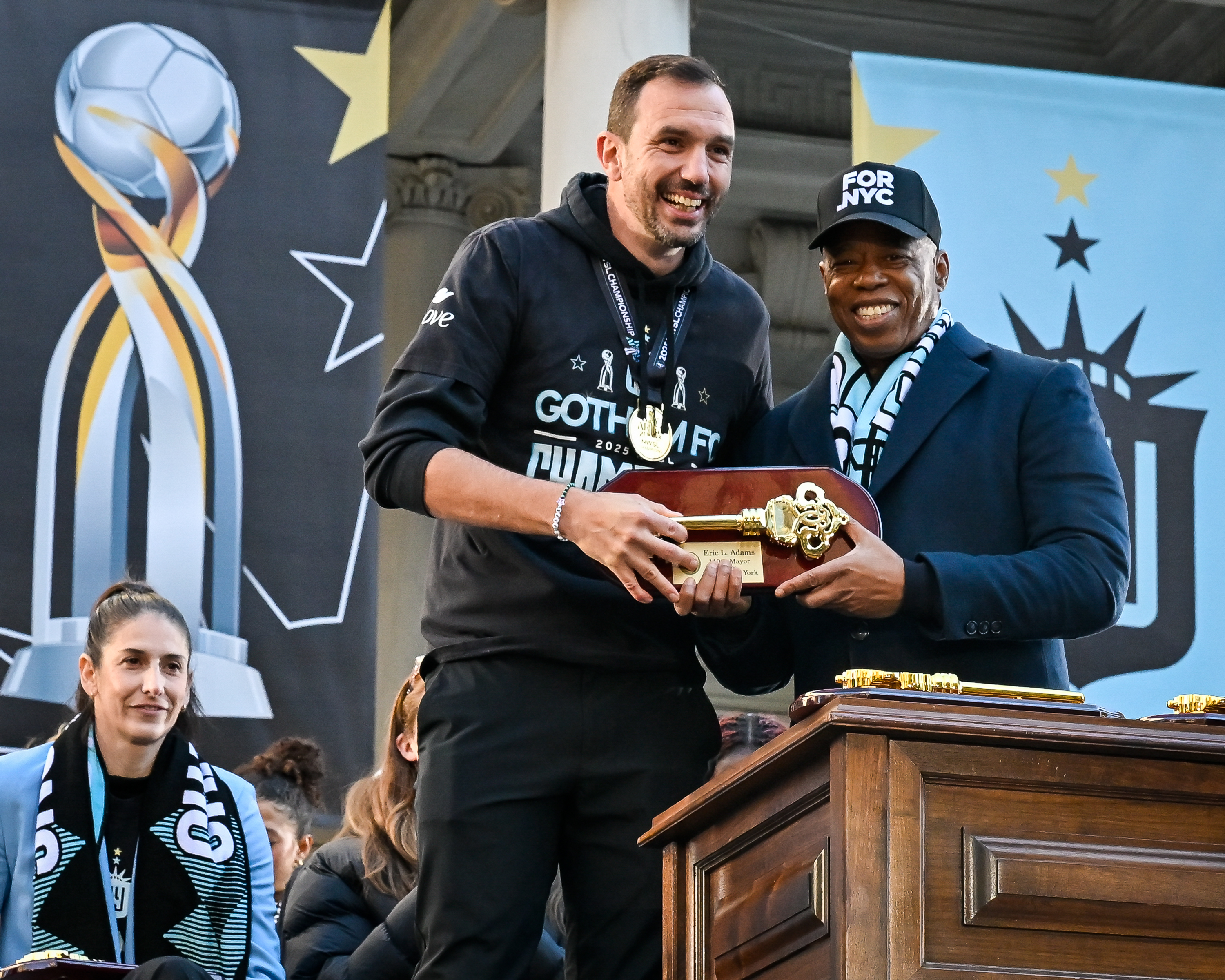 Mayor Eric Adams presents the keys to the city.