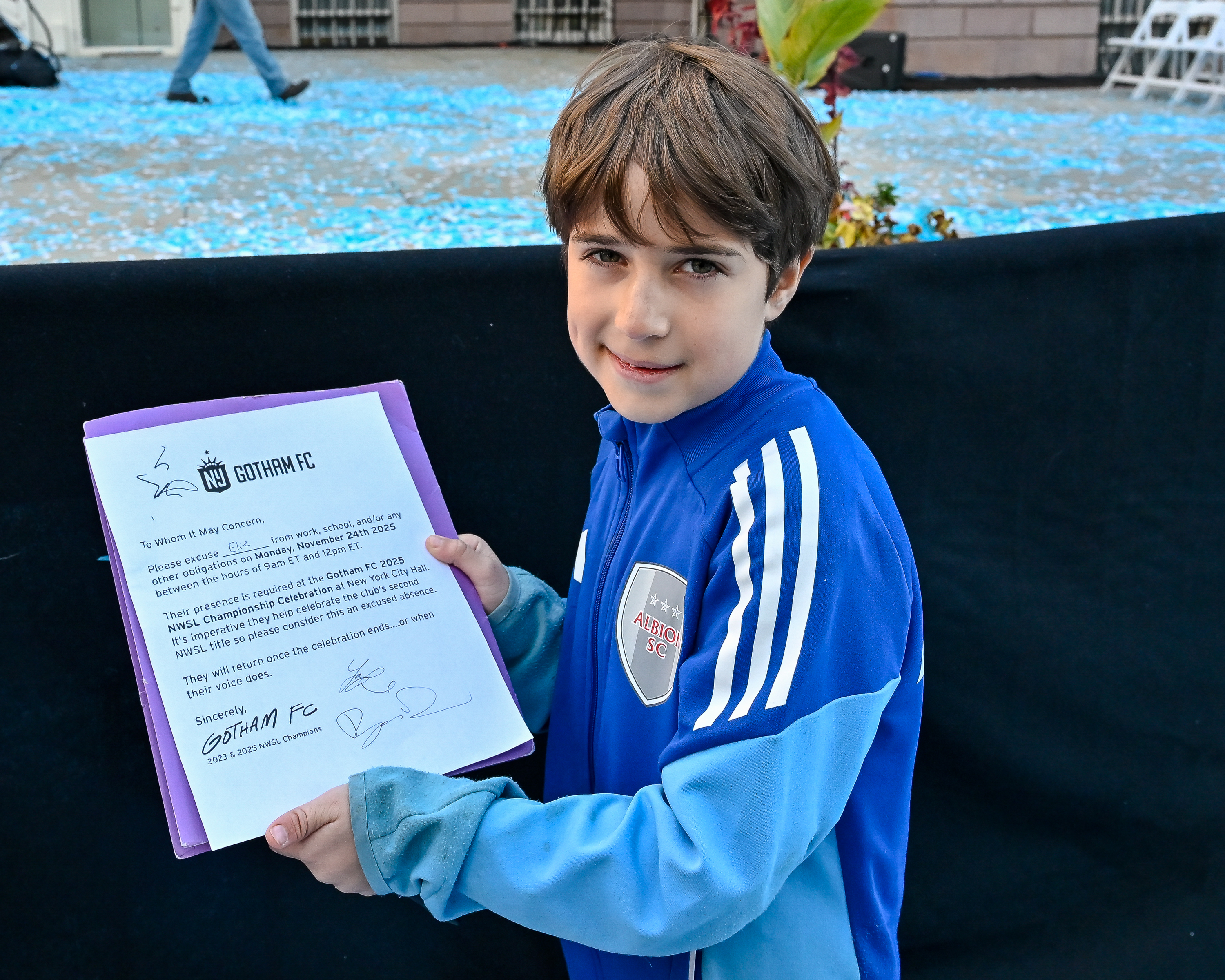 9-year-old Elie had his excuse from school signed by Gotham FC players.