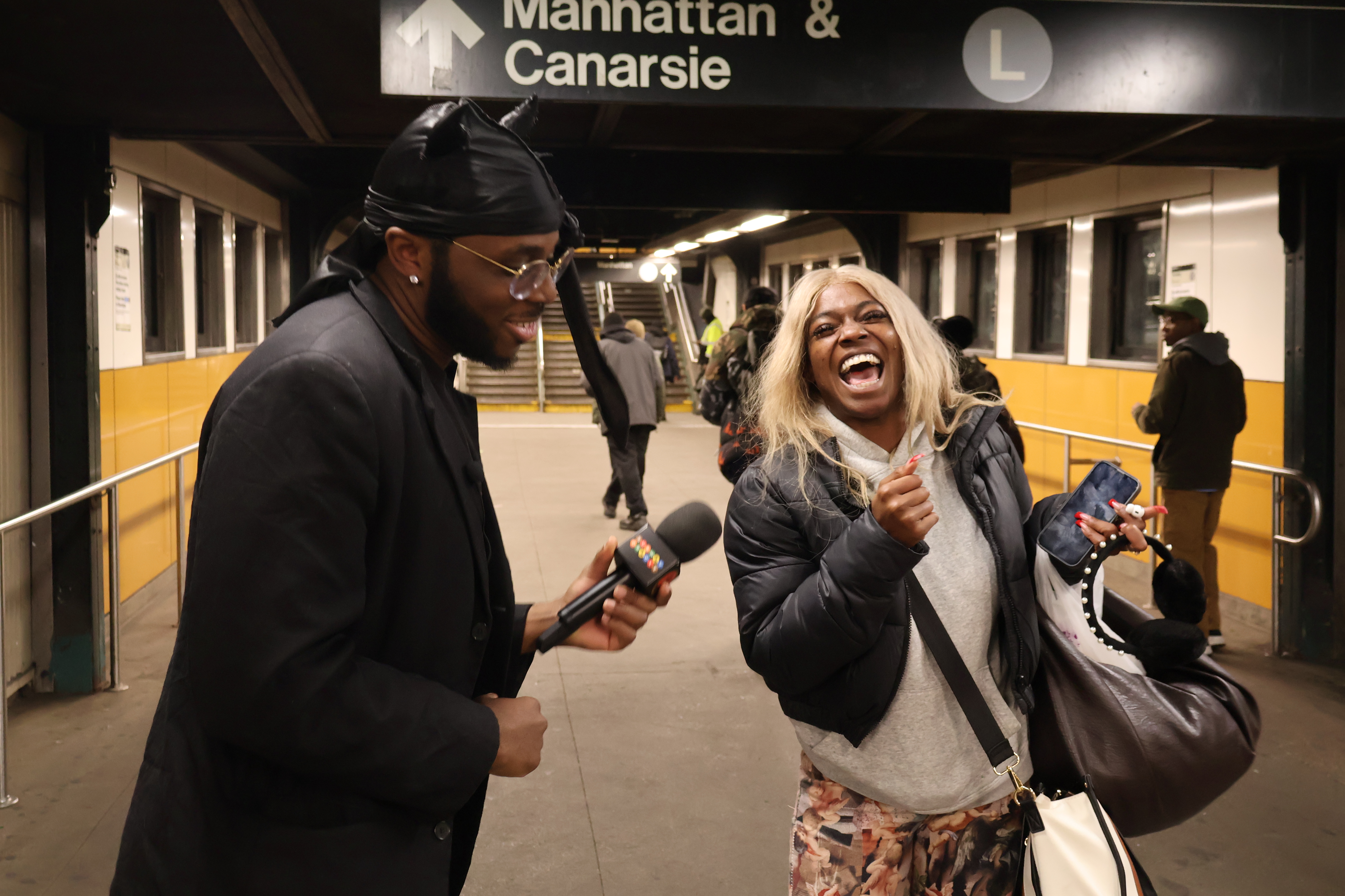 Morris Cornbread interviews a woman for his Subway Oracle series.