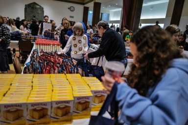 temple volunteers pack food during SNAP crisis