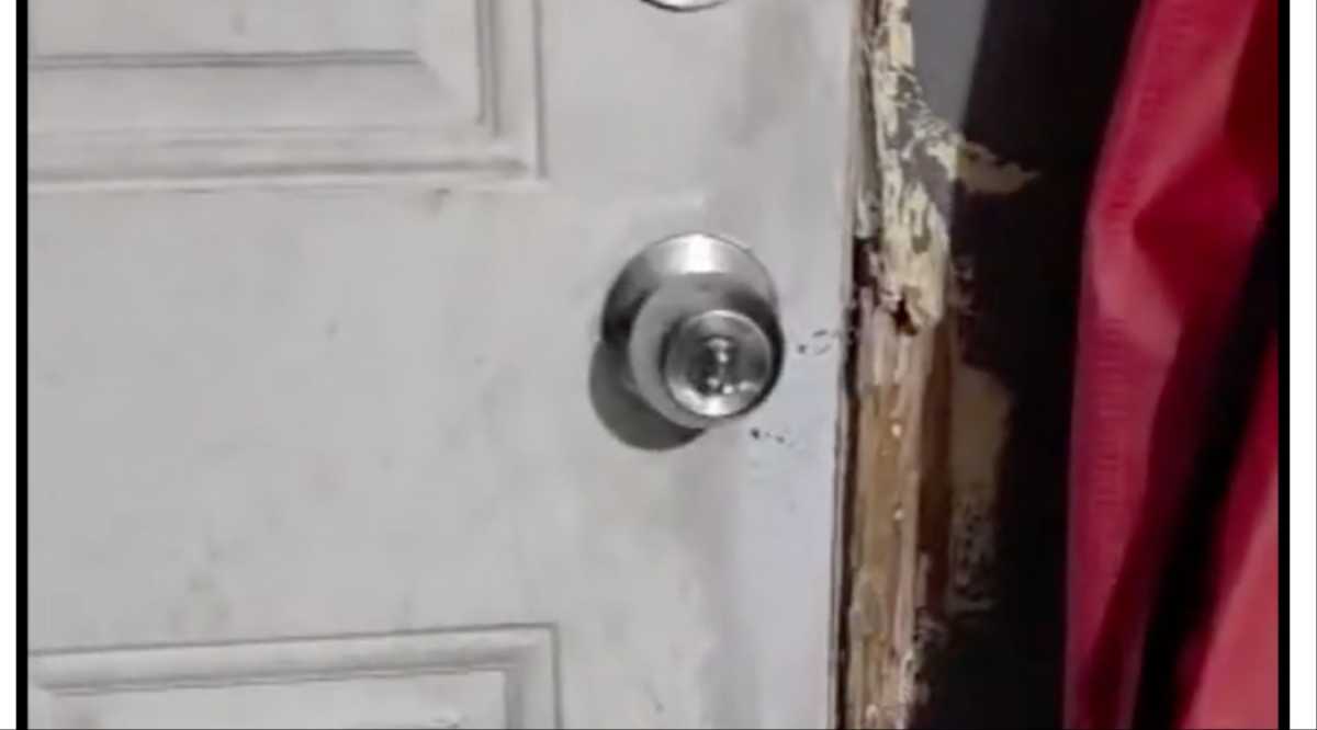 Photo shows damage to the front door of the residence in Elmhurst, allegedly caused during the ICE operation on Nov. 13.