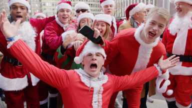 A glimpse into the modern SantaCon in New York City as seen in "SANTACON."