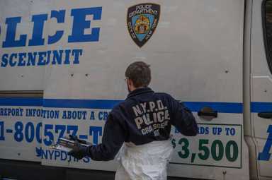 Police officers in the Bronx at a crime scene
