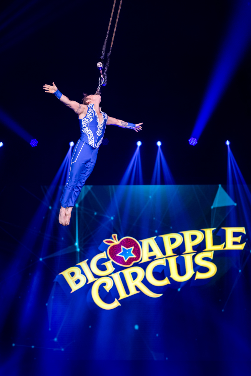 Big Apple Circus blends classic stunts with modern spectacles in new gravity-defying show 2 Big Apple Circus brings the stunts. a man hanging by his face performs at the circus.