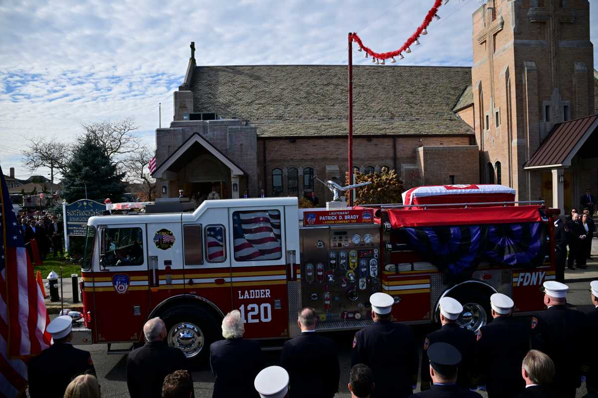 Hero's tribute: FDNY remembers fallen Lieutenant Patrick Brady at Queens funeral as a 'gift' to the bravest 2 casket of FDNY Lieutenant Patrick Brady atop engine