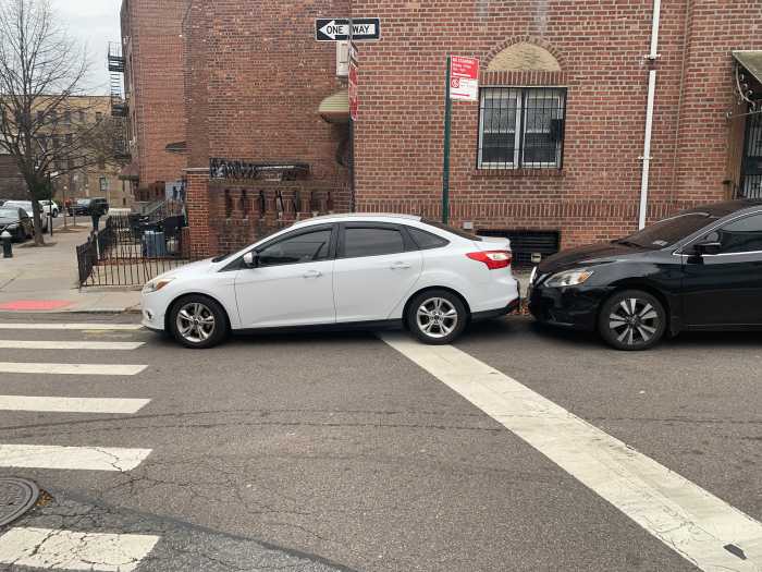Major transit advocacy group unveils ambitious transportation wish list for Mayor-elect Zohran Mamdani 2 a white car parked in a crosswalk