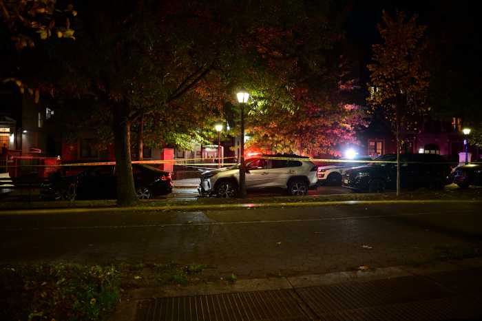 police tape blocking a crime scene at night