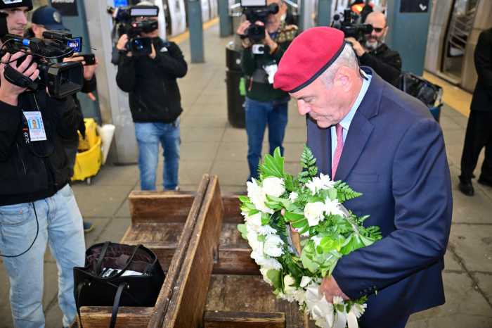 NYC Mayor's Race: One more ride for the red beret, as Curtis Sliwa campaigns to the very end 3 man holding a wreath with white flowers