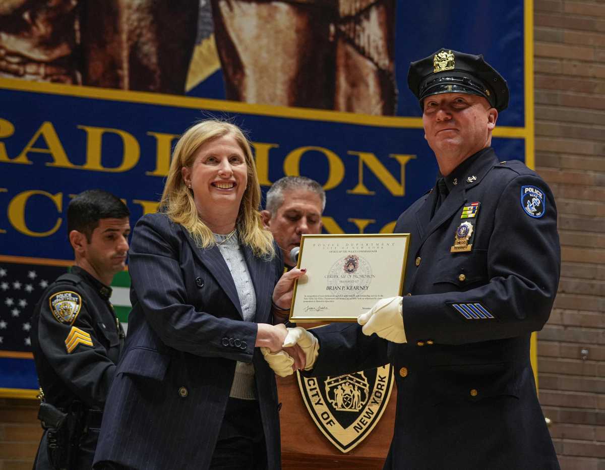 Honors for heroes: Two cops who went beyond the call of duty are promoted at NYPD headquarters 2