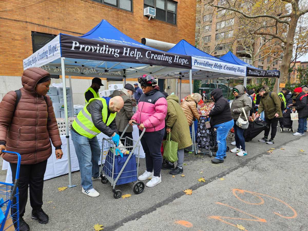people on line at a food distribution event