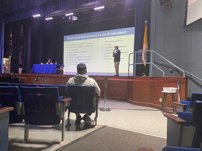IBX: Queens meeting hears some residents say 'we don't want' the new light rail commuter line in their neighborhoods 2 an auditorium with two people on stage