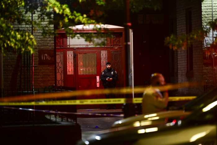 police officers in uniform in front of a building