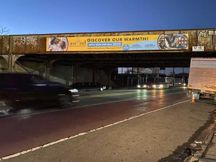 an overpasse at dusk with cars driving underneath