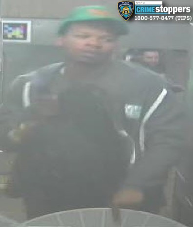 Man slashed following argument with straphanger on Manhattan subway train 10 man wearing dark clothes and green hat