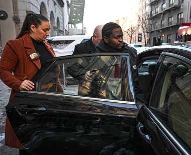 suspect loaded into back of police car after arrest for times square stabbing