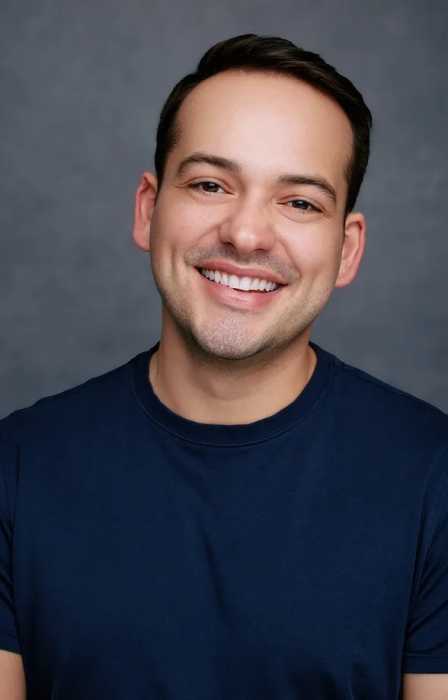 smiling man wearing a blue shirt