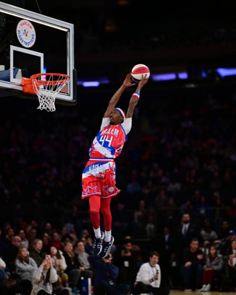 Globetrotter Baller Moss dunks during Sunday's exhibition. Photo via Harlem Globetrotters.