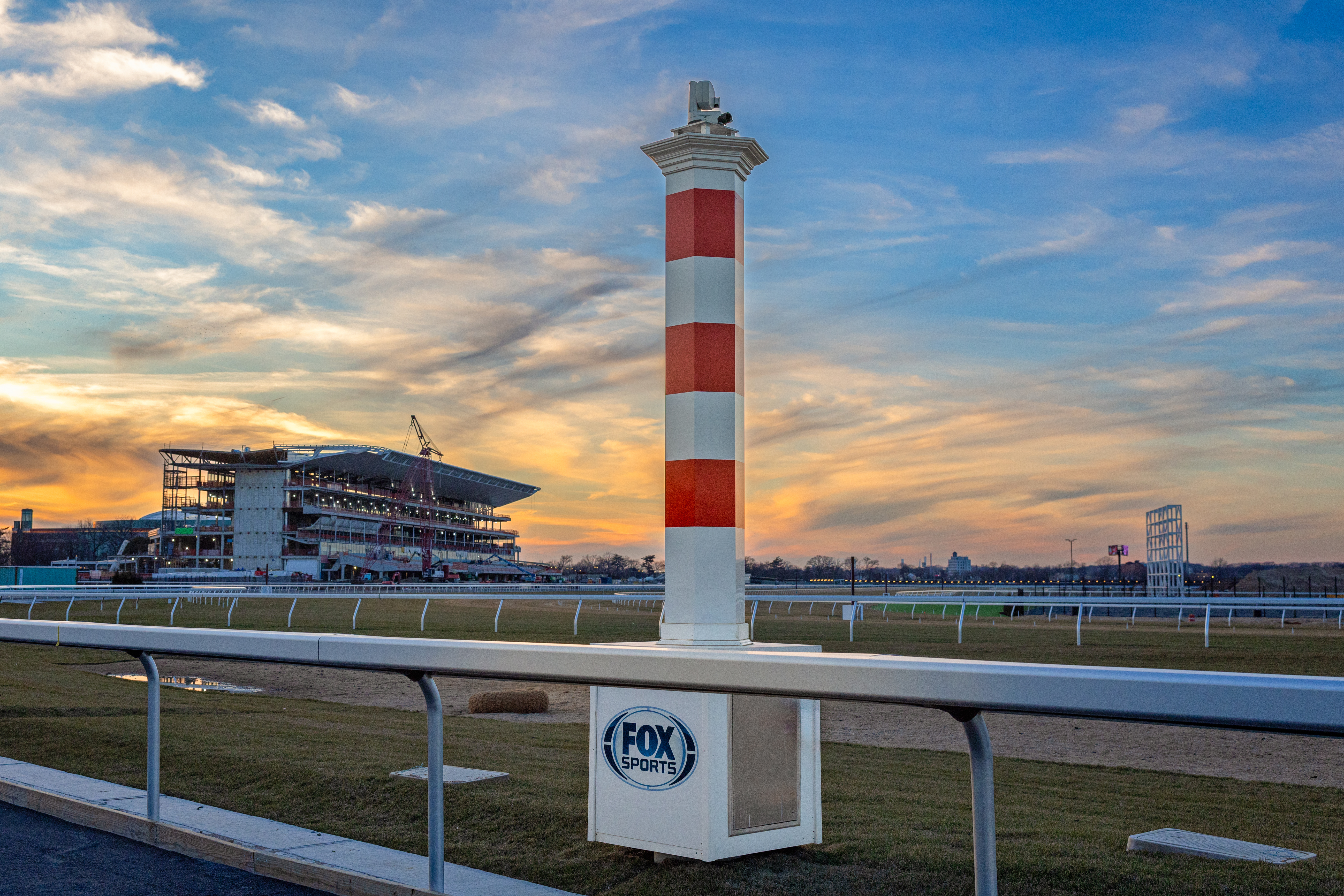 New 1 1/4 mile pole at new Belmont Park with grandstand under construction in background