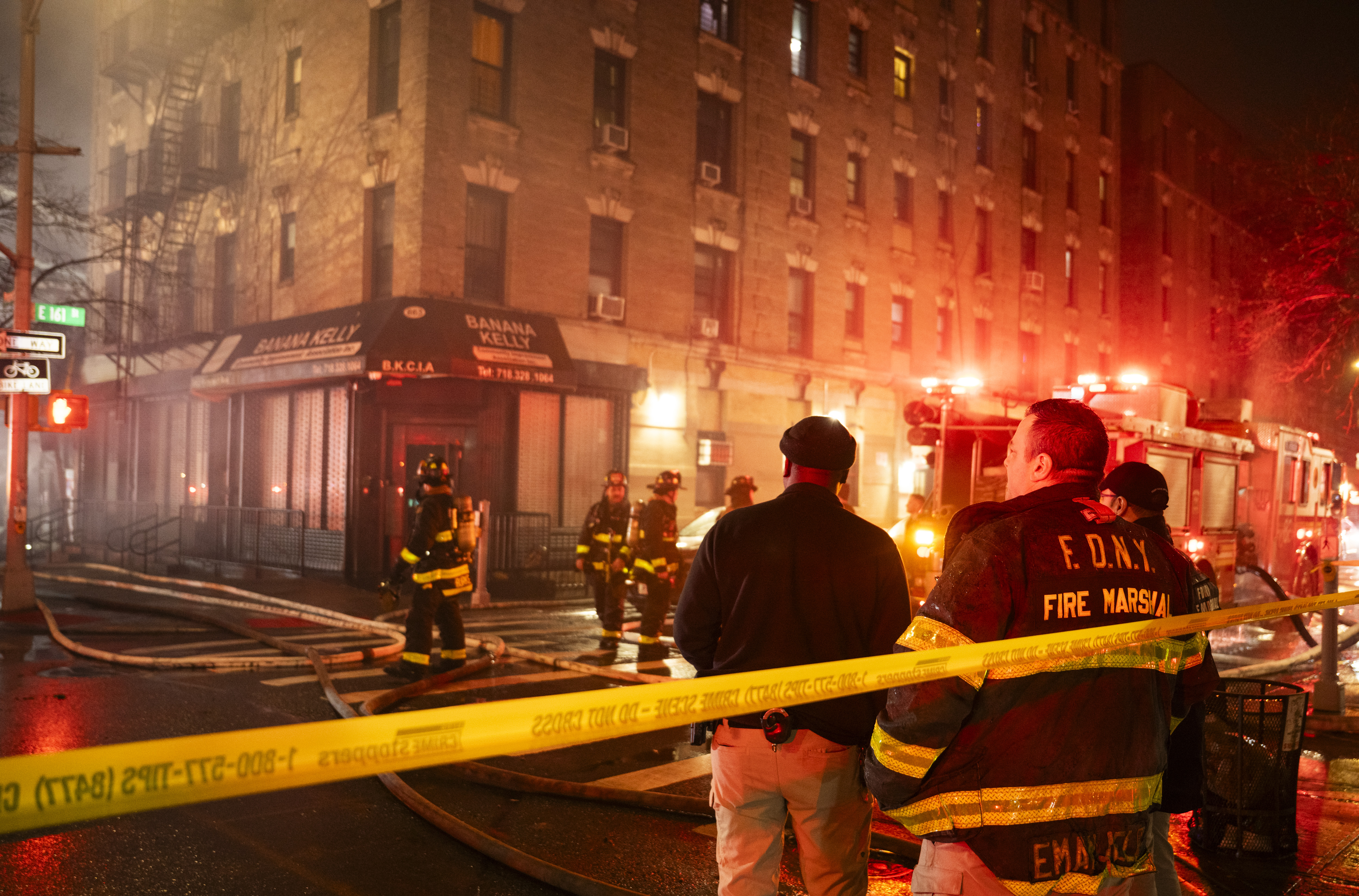Five-alarm fire rips through Bronx buildings: FDNY 7 Fire Marshals investigate the scene of a five alarm fire at 558 Prospect Avenue on Thursday, December 18.