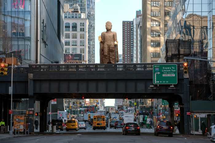 A nearly 30-foot-tall Buddha statue will tower over the High Line in 2026 1 statue on an elevated park above a street intersection