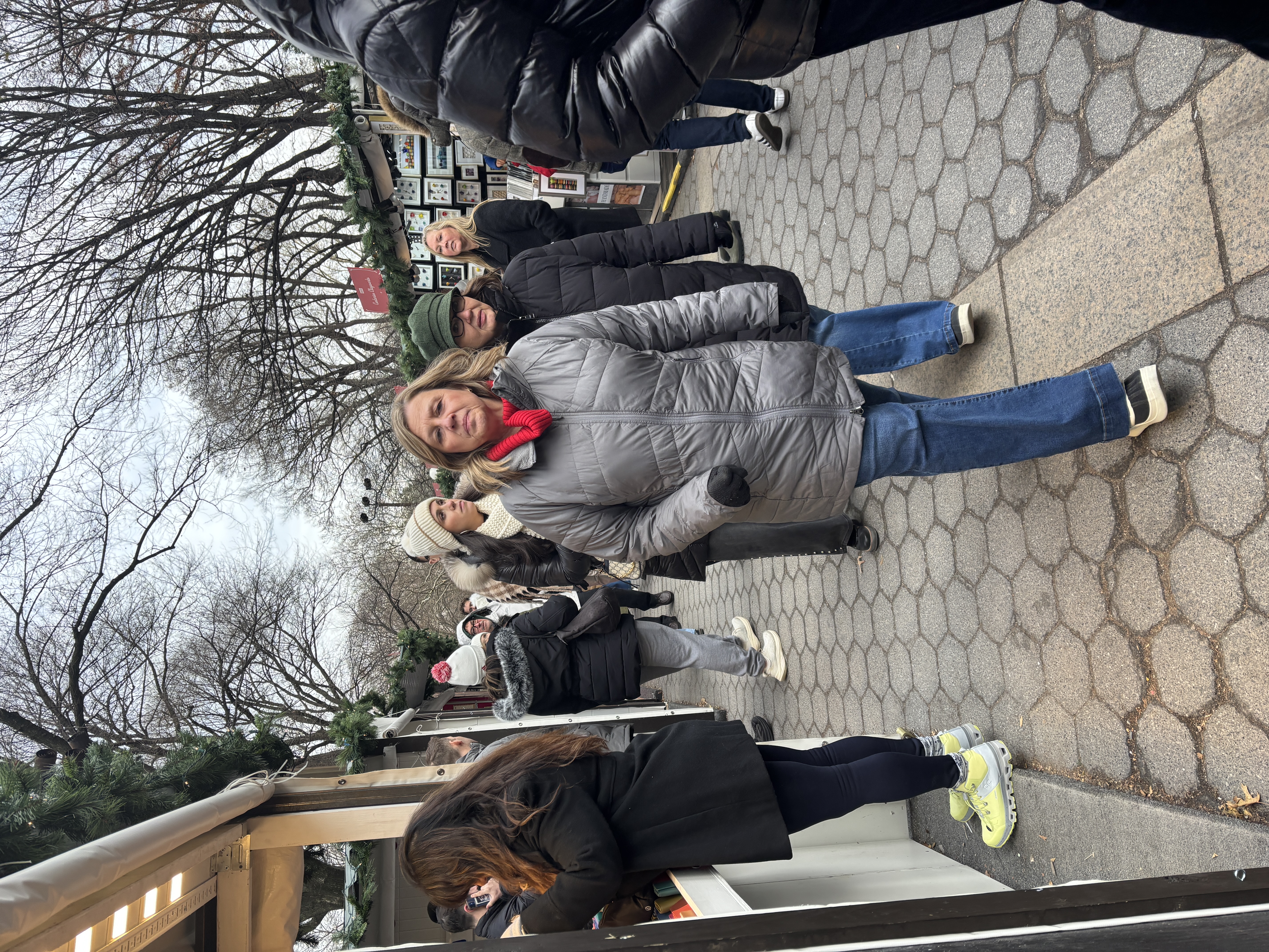People shopping at a holiday market.