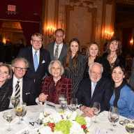 Music for medicine: A night where high society chose substance over spectacle in Manhattan 4 group of people dressed up sitting at a dinner table