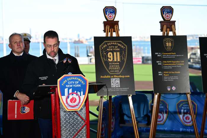 several men at a podium in a ballpark